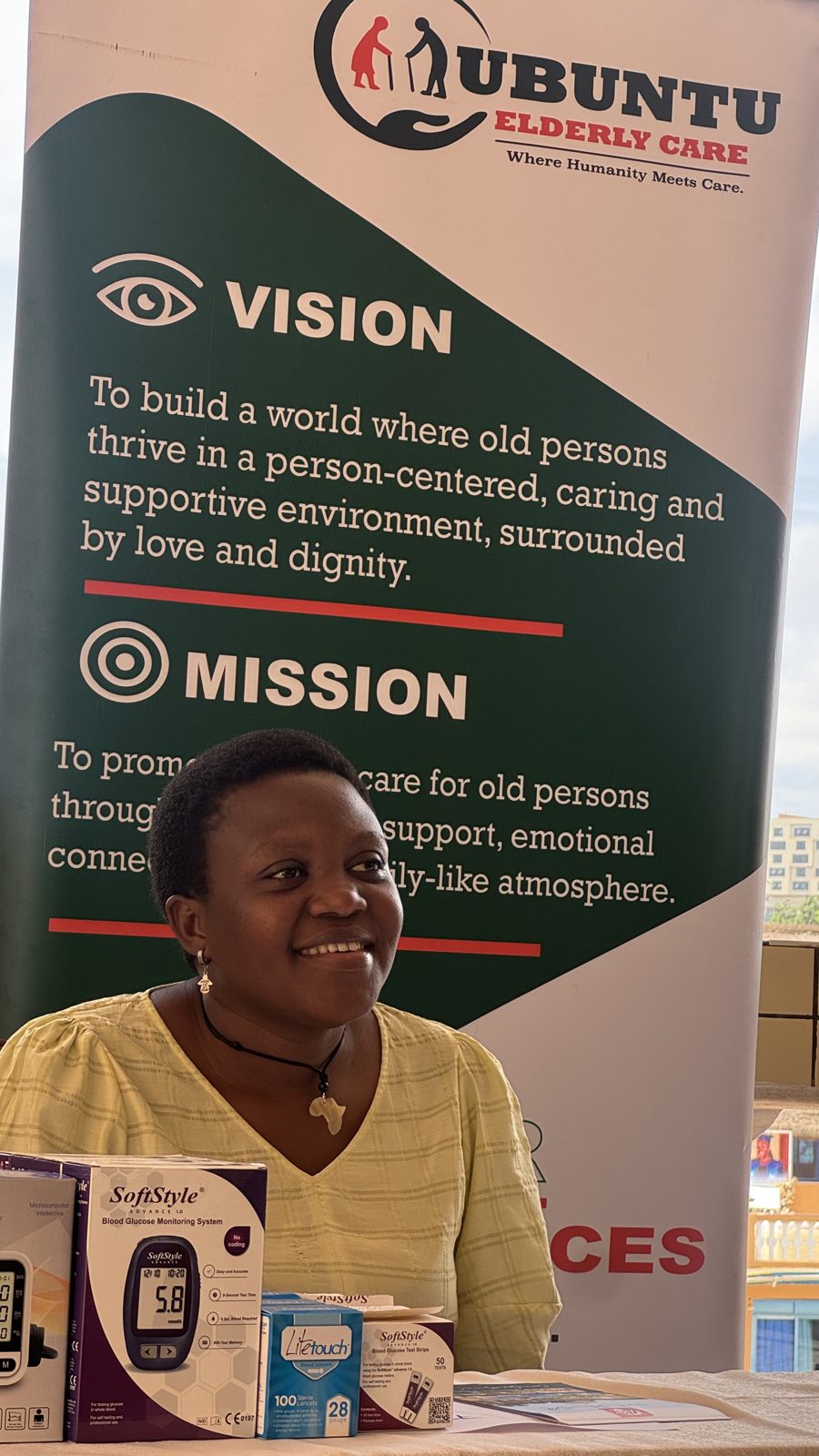 Ubuntu health screening booth with glucose monitoring — Nakawuka Health Camp, May 2026